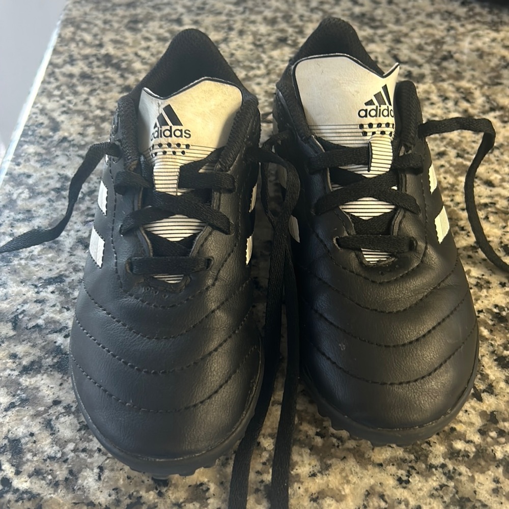 Black Adidas soccer cleats